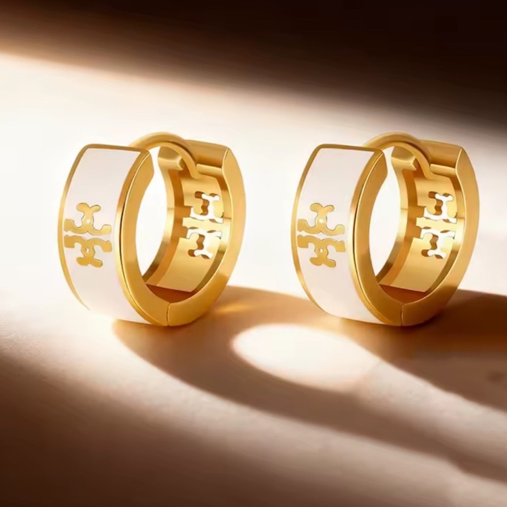 Anthropologie Gold and White Emblem Earrings